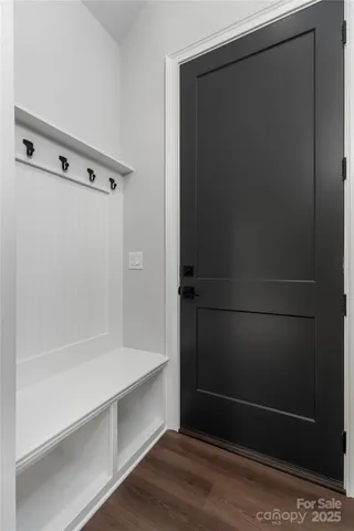 a view of a patio with table and chairs with wooden floor and fence
