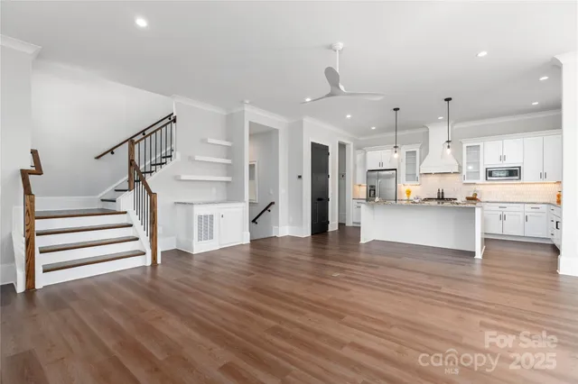 a view of kitchen with cabinets and wooden floor