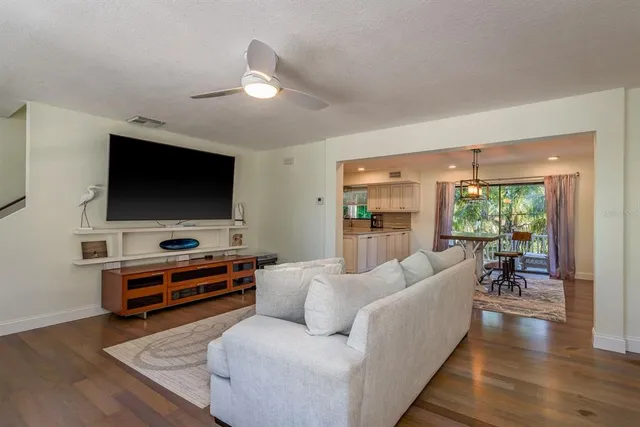 a bathroom with a granite countertop sink a toilet and a shower