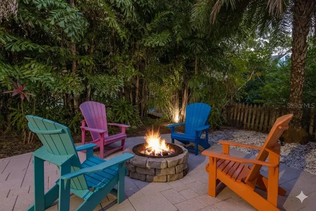 a kitchen with a sink a counter space appliances and cabinets