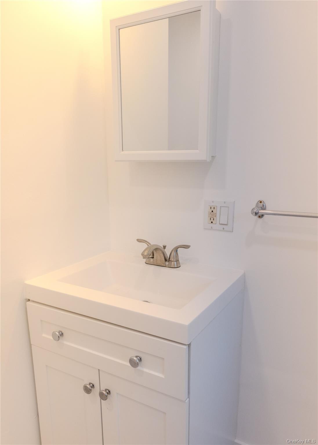 23 Lucille Road Carmel, NY 10512 - Photo 17 of 44 a bathroom with a sink and cabinets