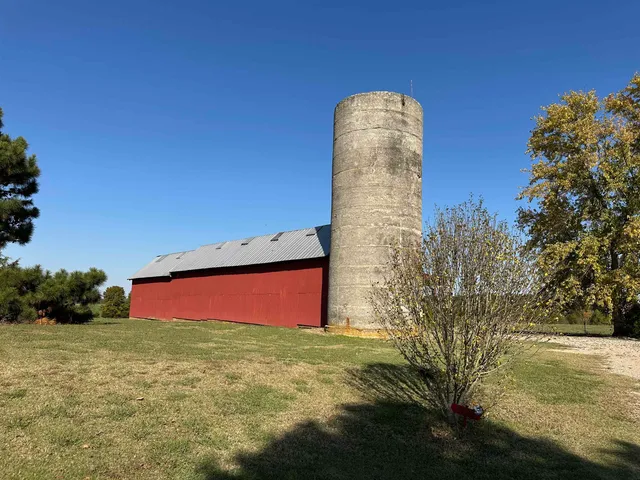 a view of a pool with a yard