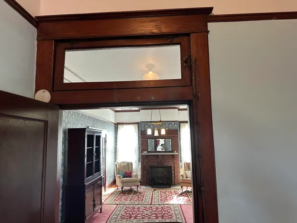 a living room with a toilet and a fireplace
