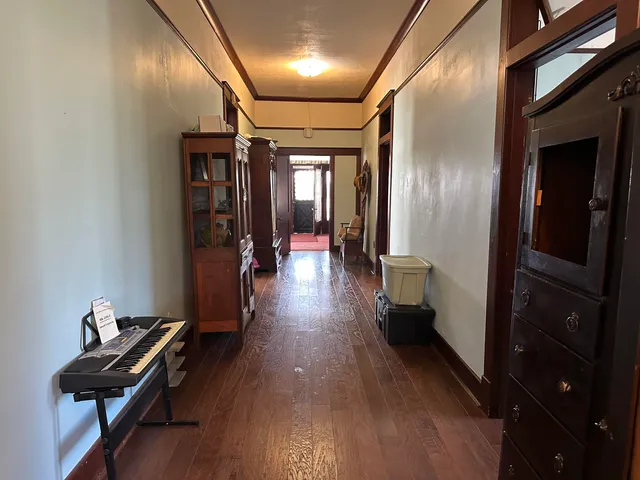 a hallway with wooden floor