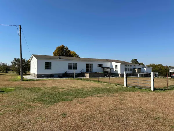 a house view with a backyard space