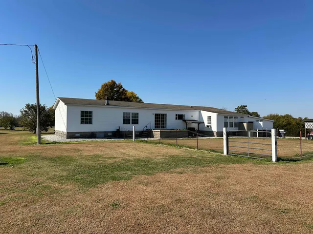 a house view with a backyard space