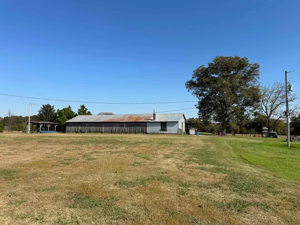 a view of a pool with a yard