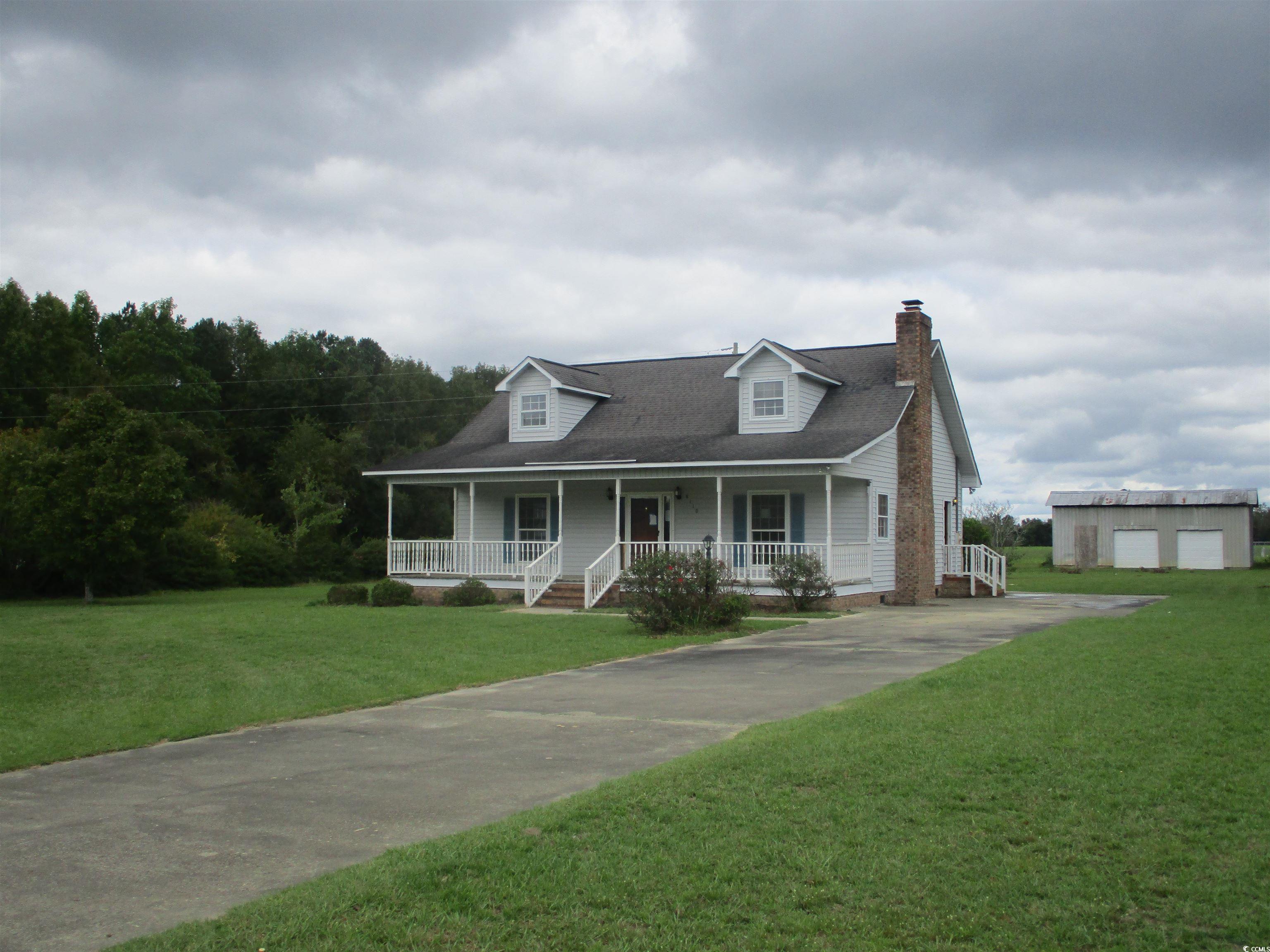 8110 Elvington Road Nichols, SC 29581 - Photo 1 of 17 View of front of property with a shed, a porch, an