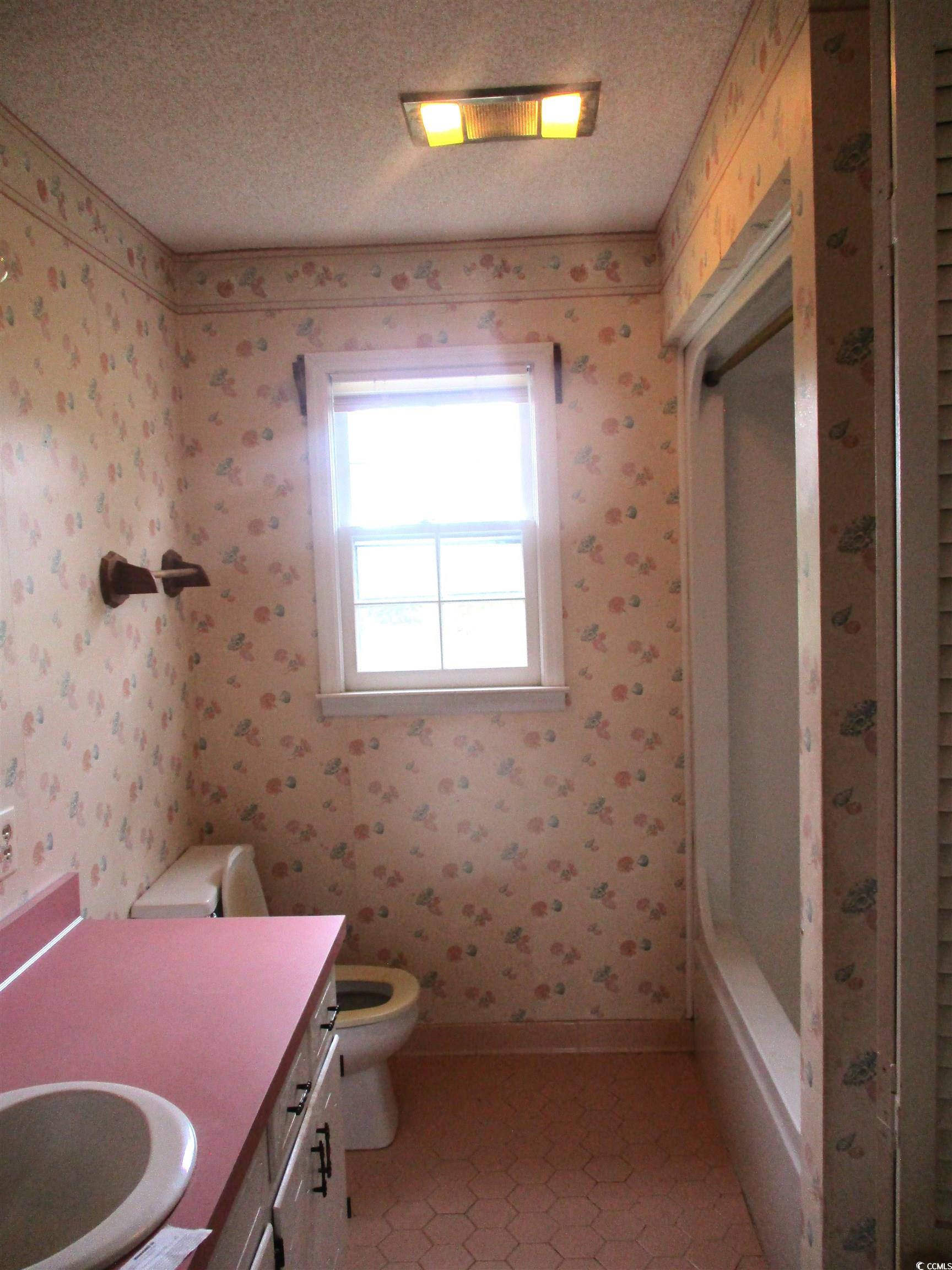 8110 Elvington Road Nichols, SC 29581 - Photo 12 of 17 Bathroom featuring a textured ceiling, vanity, and
