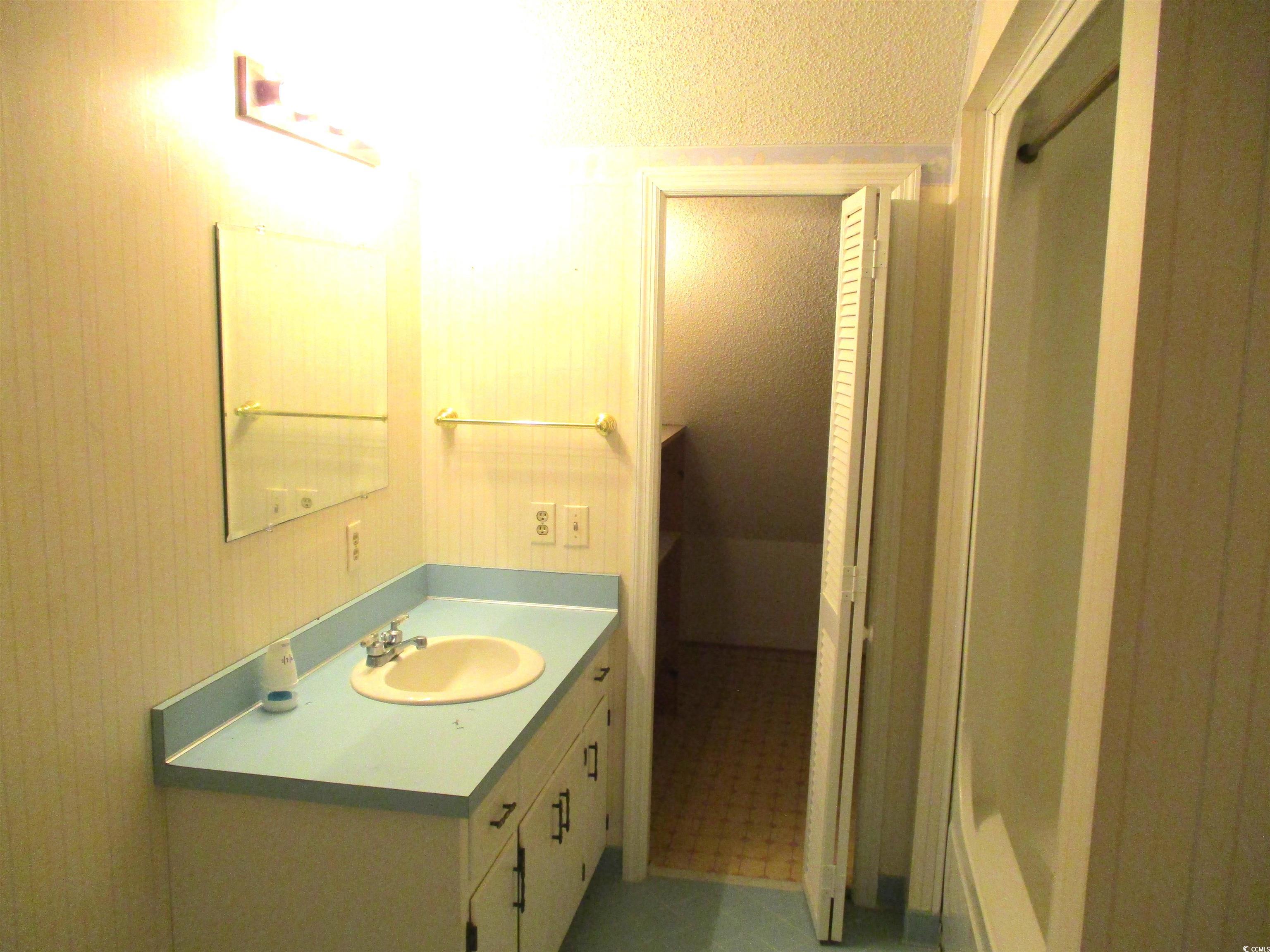 8110 Elvington Road Nichols, SC 29581 - Photo 14 of 17 Bathroom with vanity and tile patterned floors