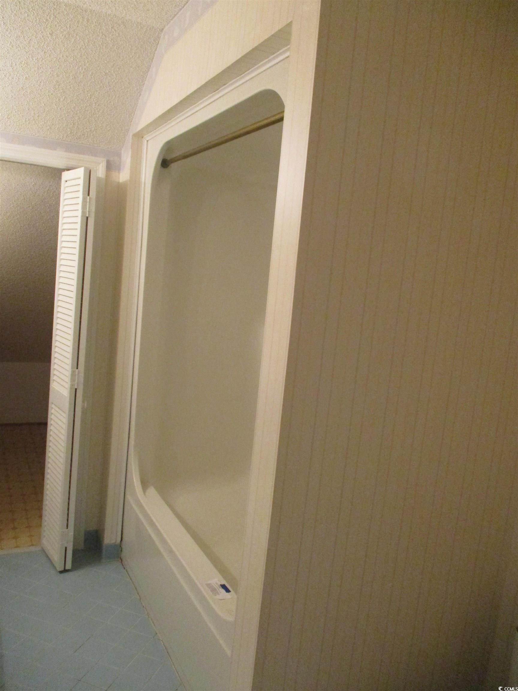 8110 Elvington Road Nichols, SC 29581 - Photo 15 of 17 Bathroom with a textured ceiling and tile patterne