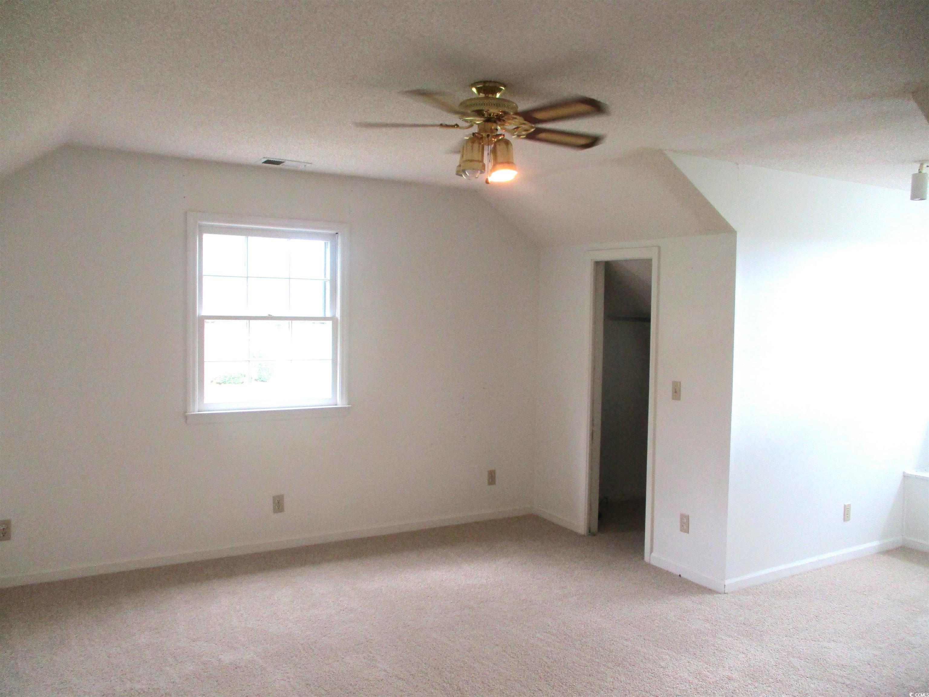 8110 Elvington Road Nichols, SC 29581 - Photo 16 of 17 Bonus room with vaulted ceiling, ceiling fan, ligh