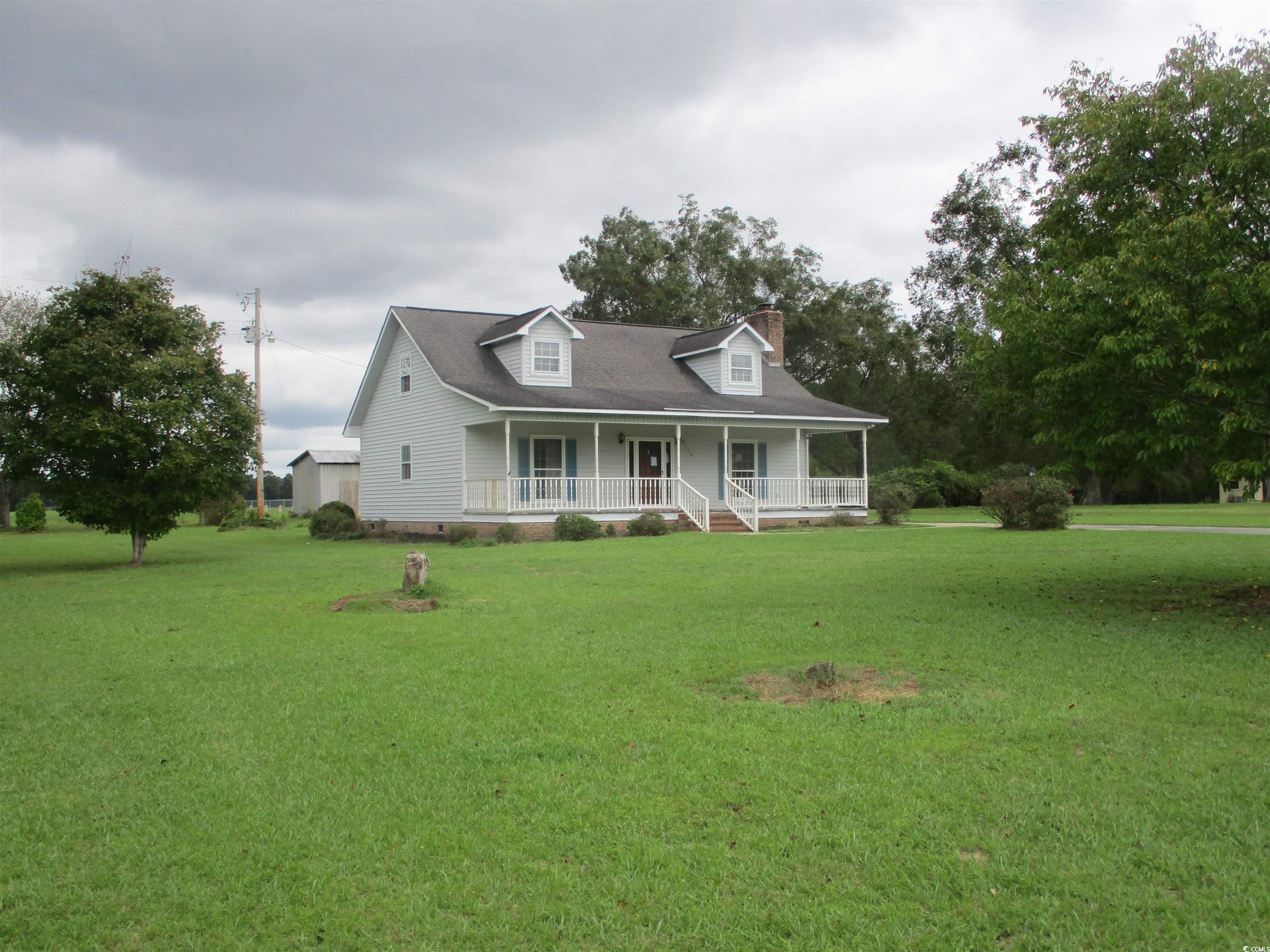 8110 Elvington Road Nichols, SC 29581 - Photo 2 of 17 Country-style home featuring a porch and a front l