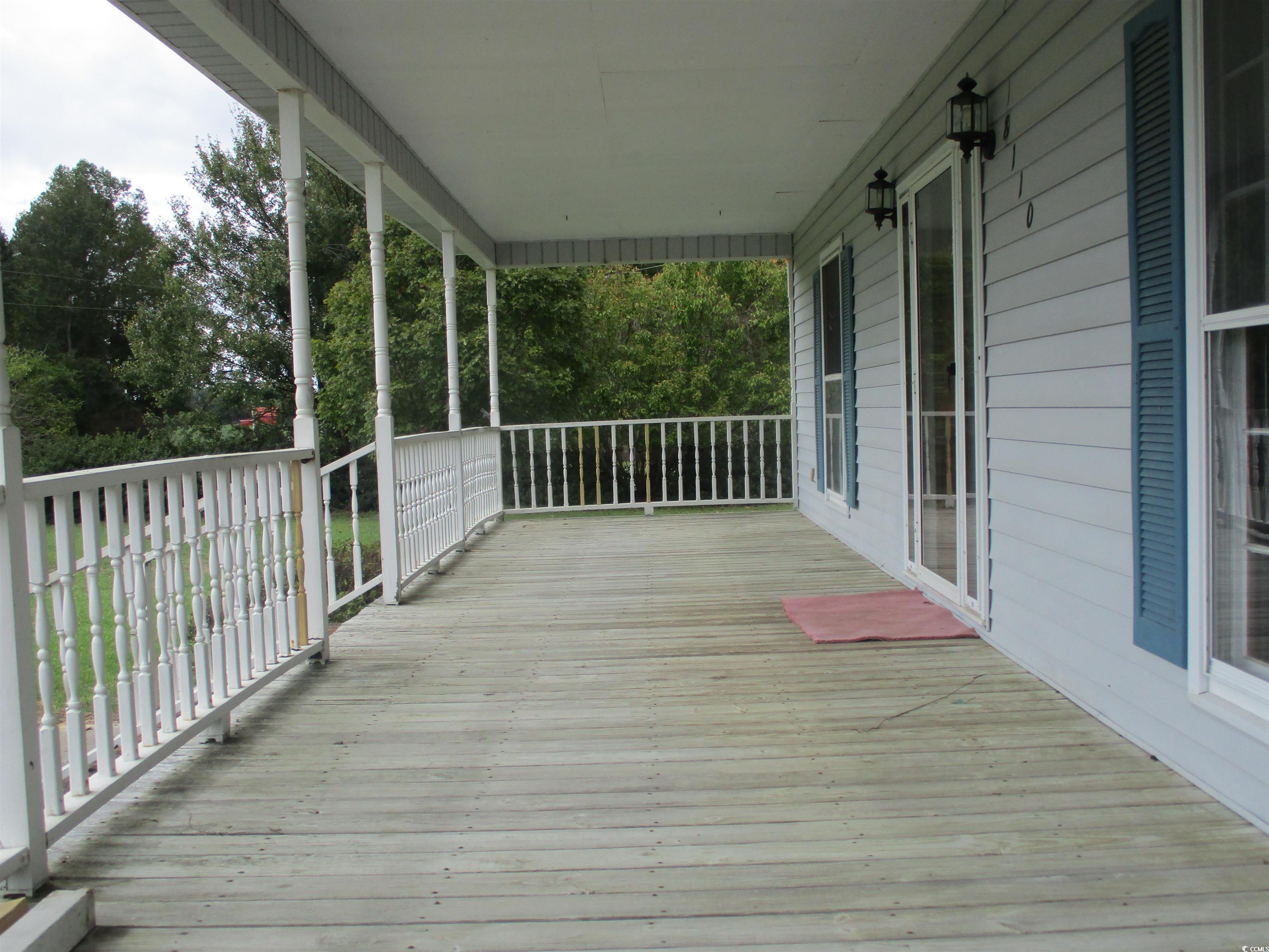 8110 Elvington Road Nichols, SC 29581 - Photo 5 of 17 Wooden terrace with a porch