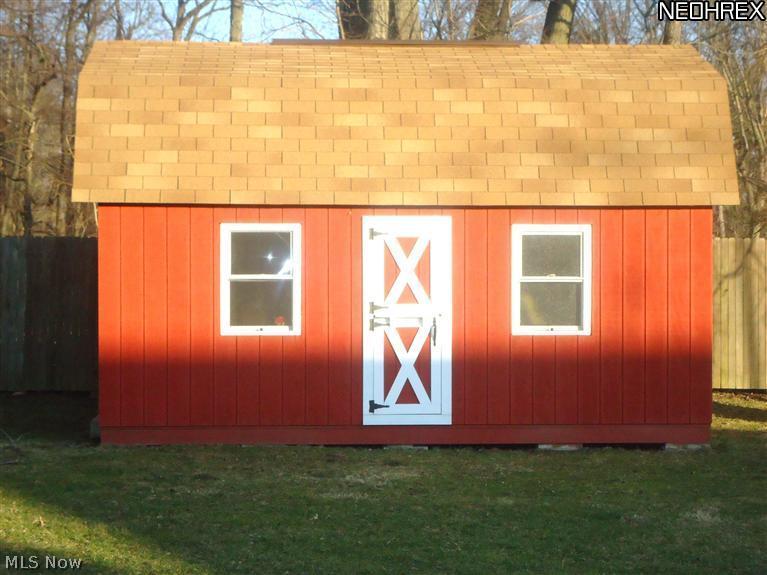 4315 Mayfair Road Uniontown, OH 44685 - Photo 24 of 25 Extra storage shed for valuable lawn equipment, extra storage or a great play house for the children.