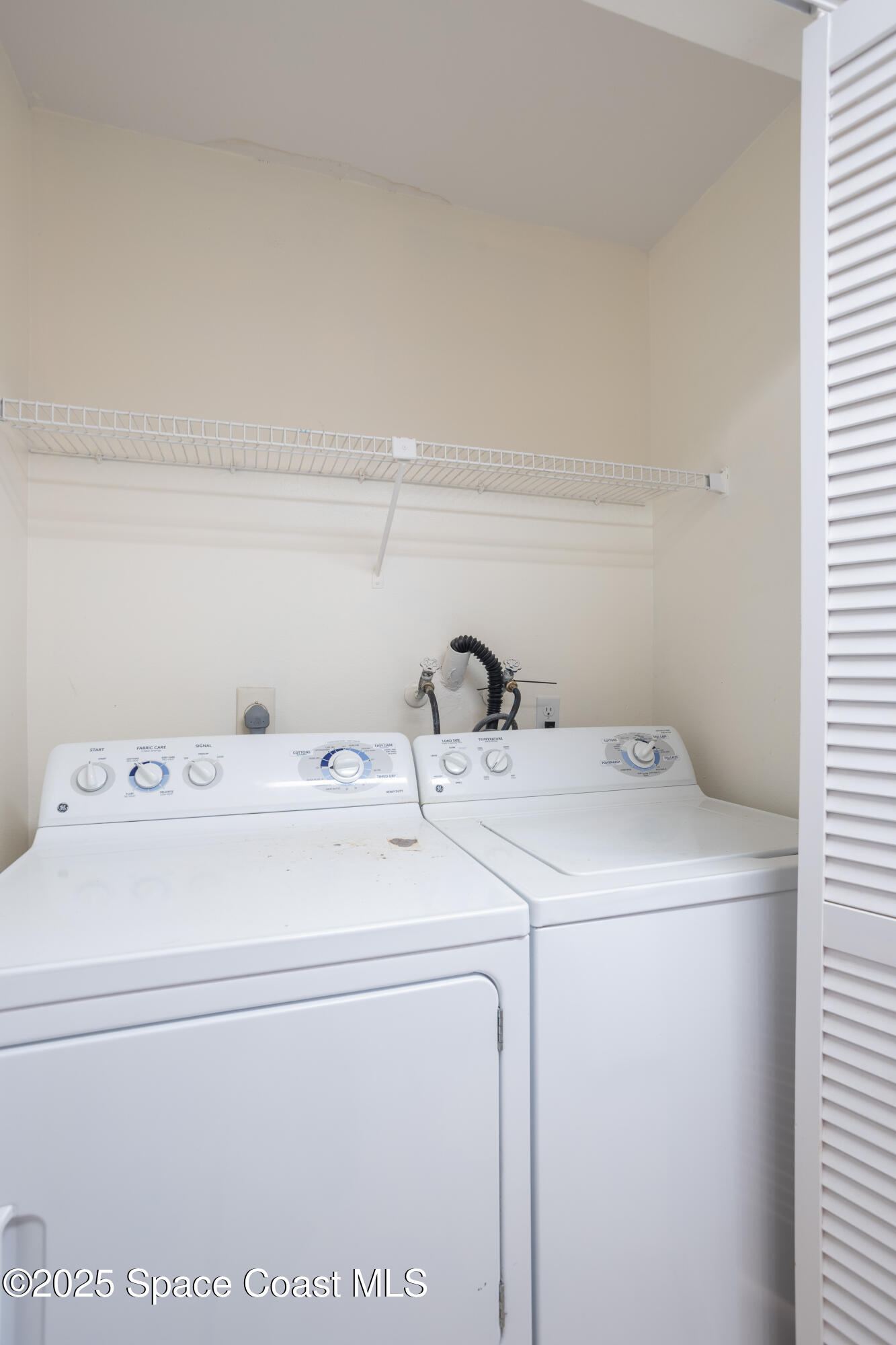 101 Summer Place, Unit 6 Merritt Island, FL 32953 - Photo 11 of 28 a utility room with dryer and washer