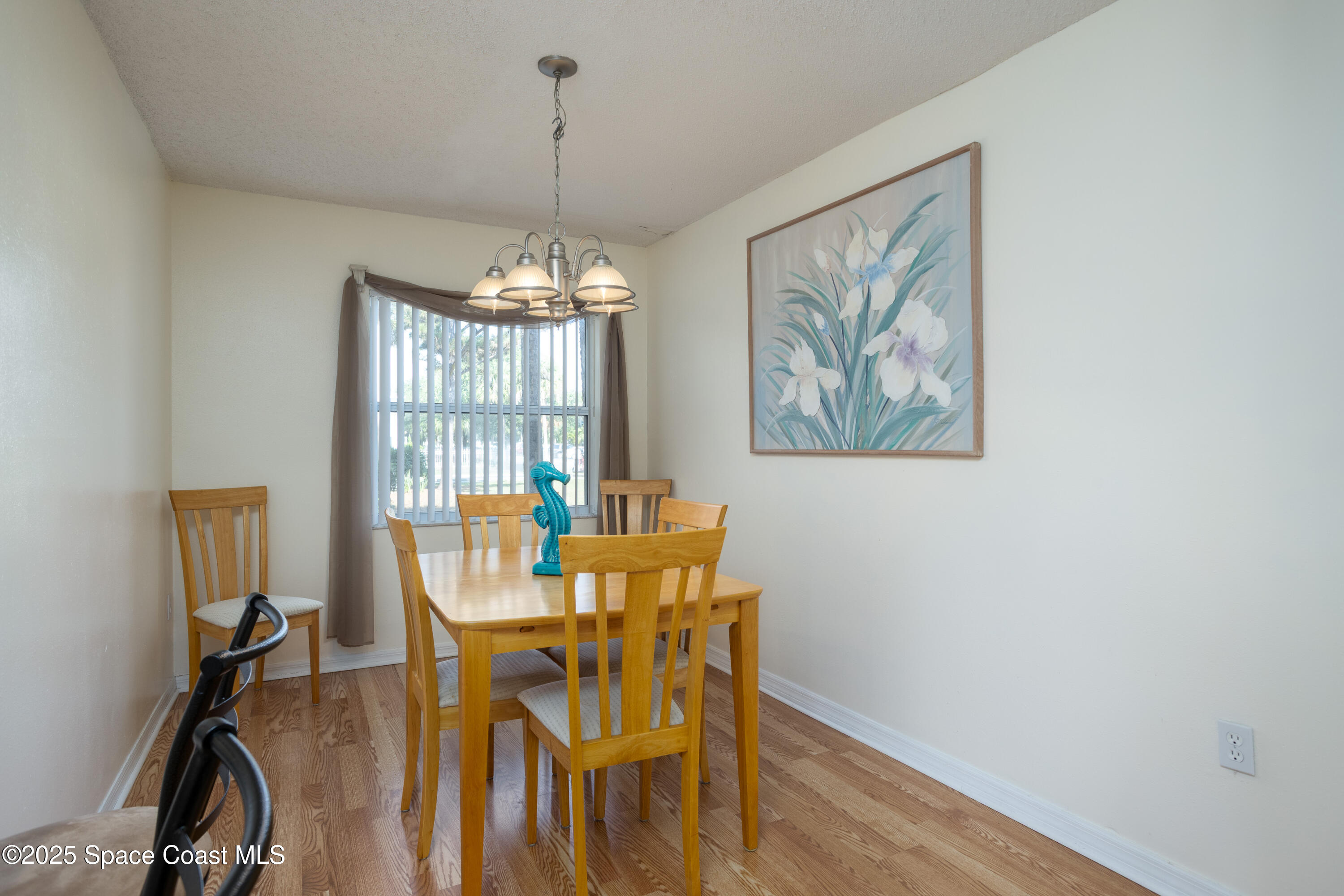 101 Summer Place, Unit 6 Merritt Island, FL 32953 - Photo 12 of 28 a dining room with furniture and window