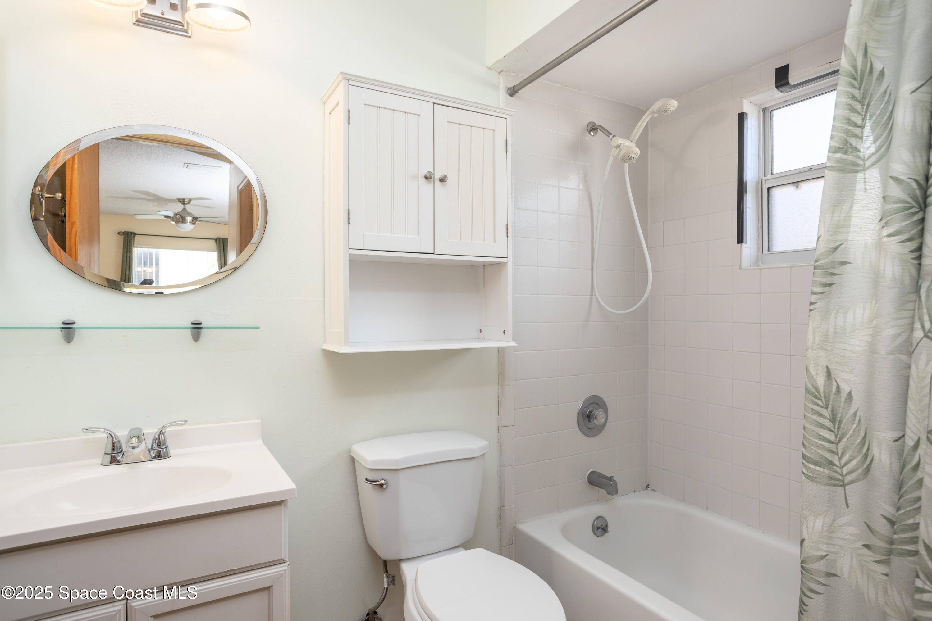 101 Summer Place, Unit 6 Merritt Island, FL 32953 - Photo 16 of 28 a bathroom with a sink toilet and a mirror