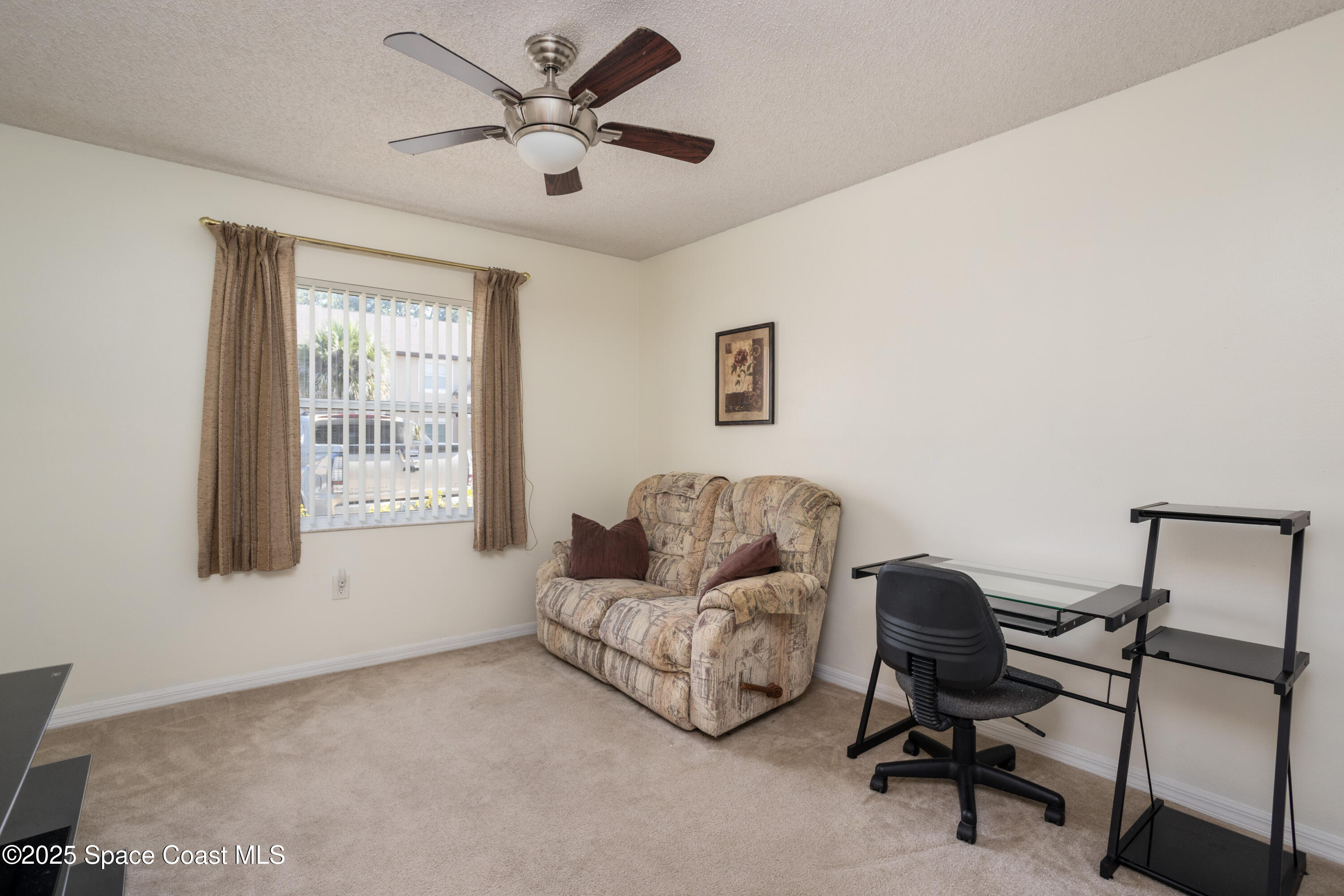 101 Summer Place, Unit 6 Merritt Island, FL 32953 - Photo 18 of 28 a living room with furniture and a window