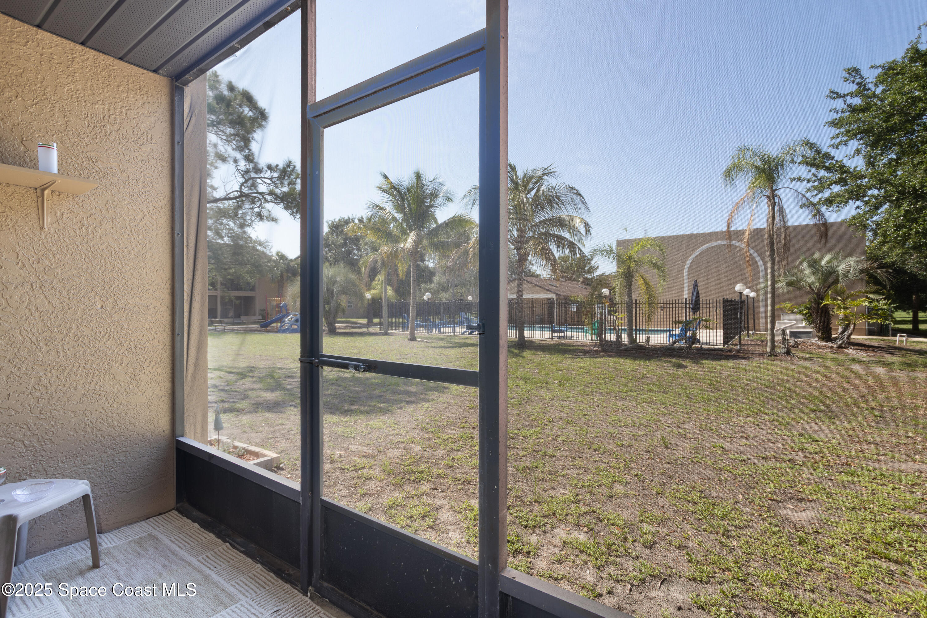 101 Summer Place, Unit 6 Merritt Island, FL 32953 - Photo 21 of 28 a view of swimming pool from a balcony