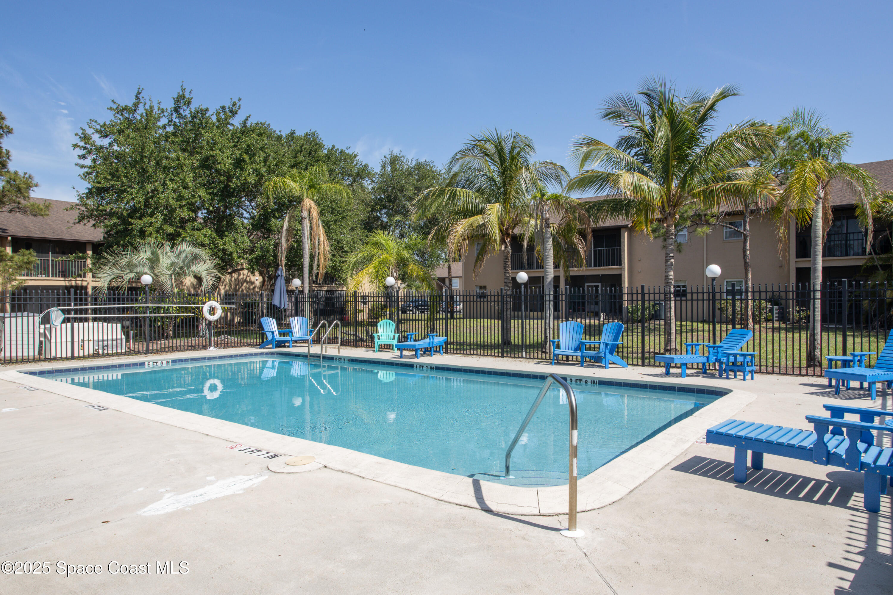 101 Summer Place, Unit 6 Merritt Island, FL 32953 - Photo 26 of 28 a view of a backyard with swimming pool and sitting area