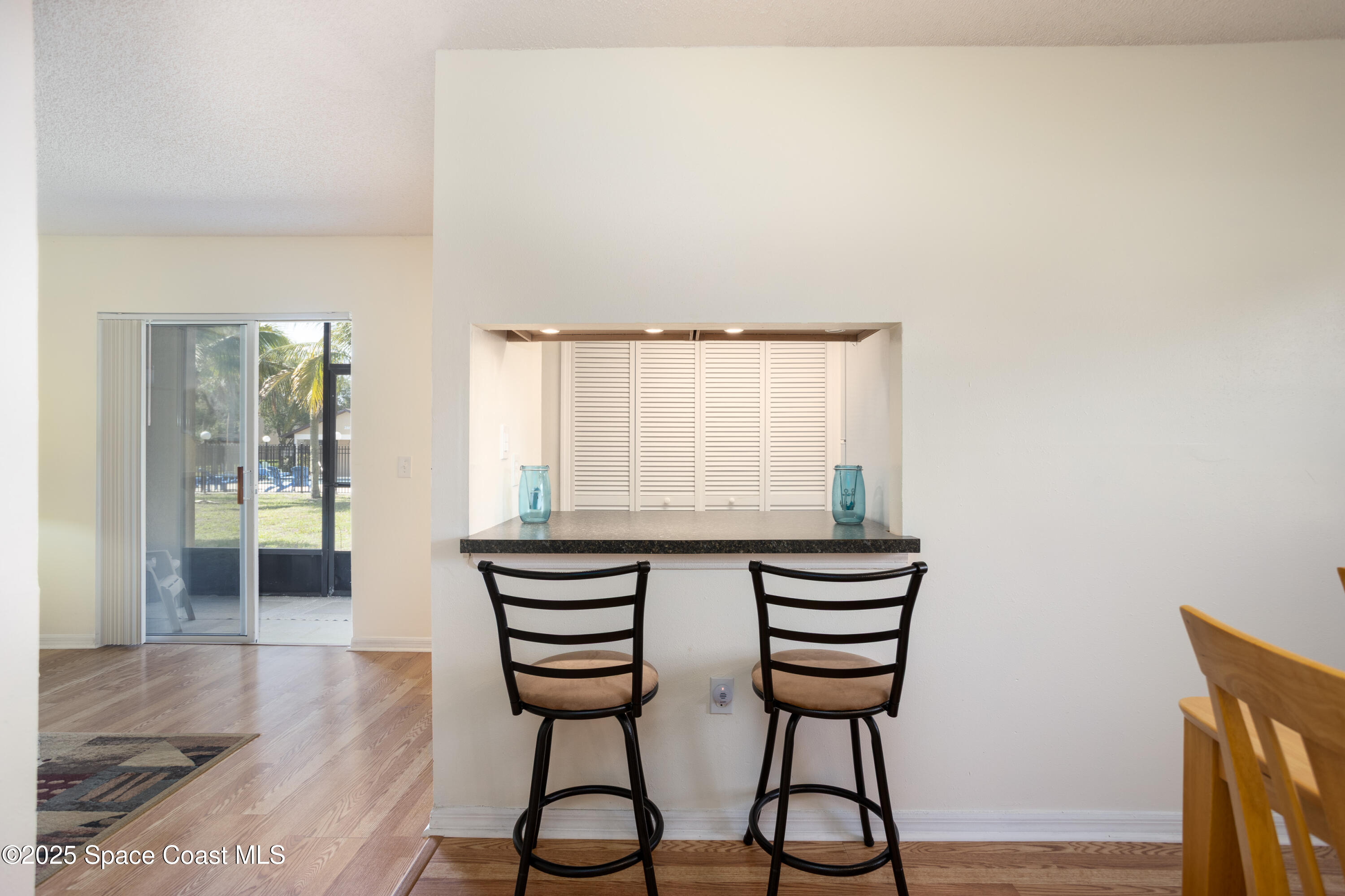 101 Summer Place, Unit 6 Merritt Island, FL 32953 - Photo 7 of 28 a view of a livingroom with furniture and wooden floor