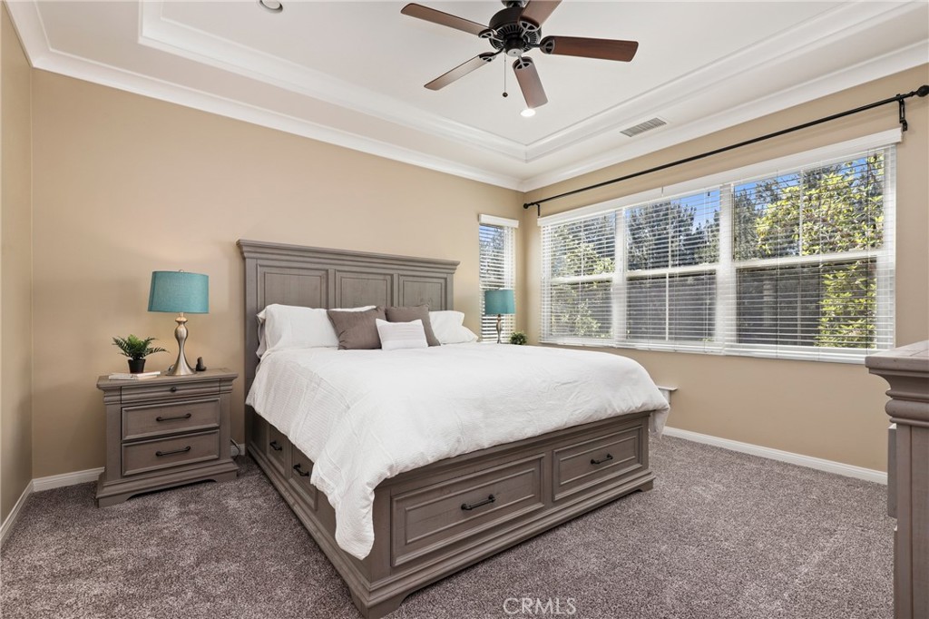 24 Lacebark, Unit 48 Irvine, CA 92618 - Photo 18 of 42 a spacious bedroom with a bed and a window