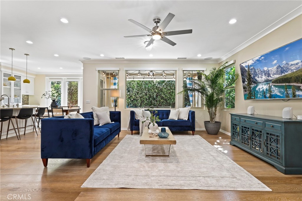 24 Lacebark, Unit 48 Irvine, CA 92618 - Photo 2 of 42 a living room with furniture a large window and a fireplace