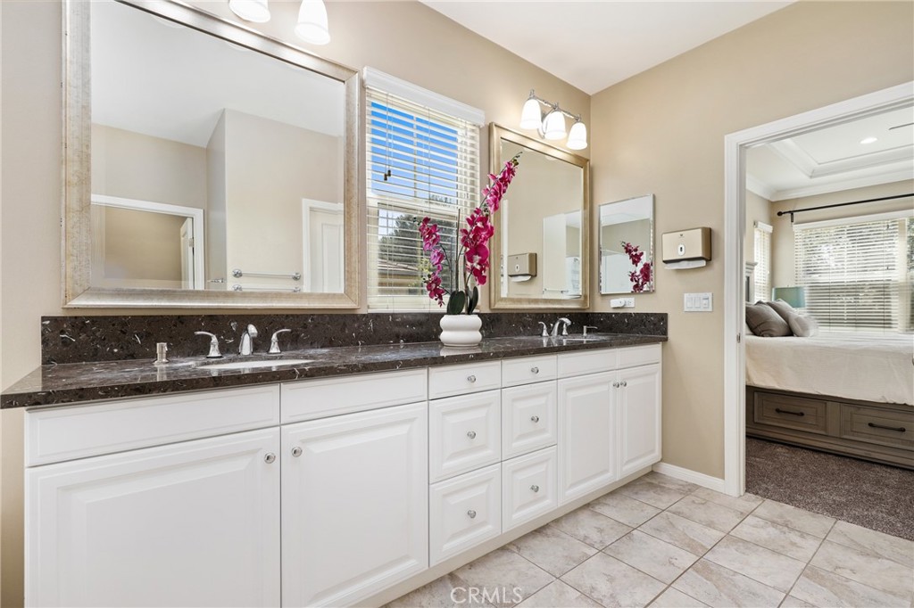 24 Lacebark, Unit 48 Irvine, CA 92618 - Photo 22 of 42 a bathroom with a sink and a mirror