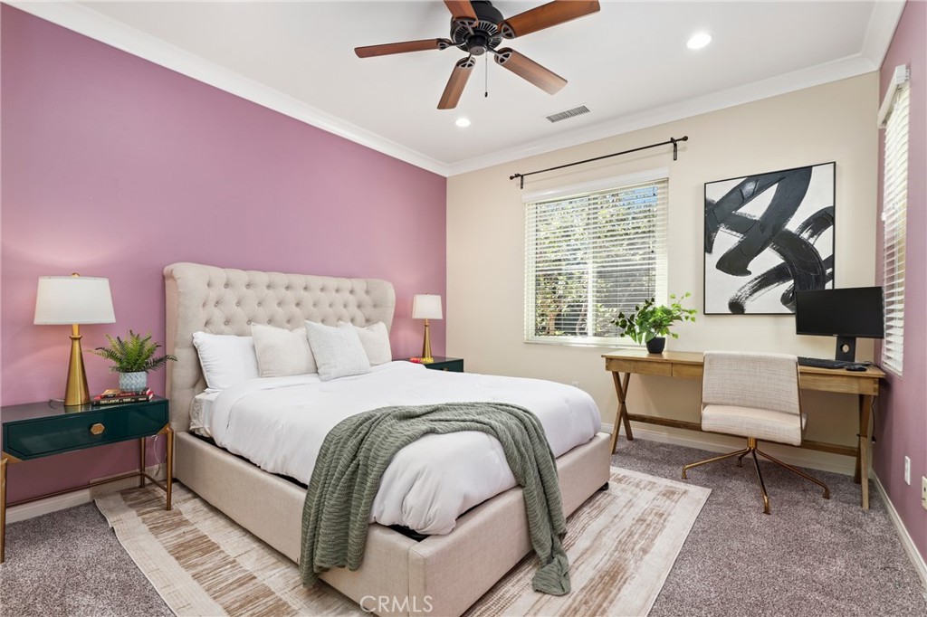 24 Lacebark, Unit 48 Irvine, CA 92618 - Photo 24 of 42 a bedroom with a bed and a painting on the wall