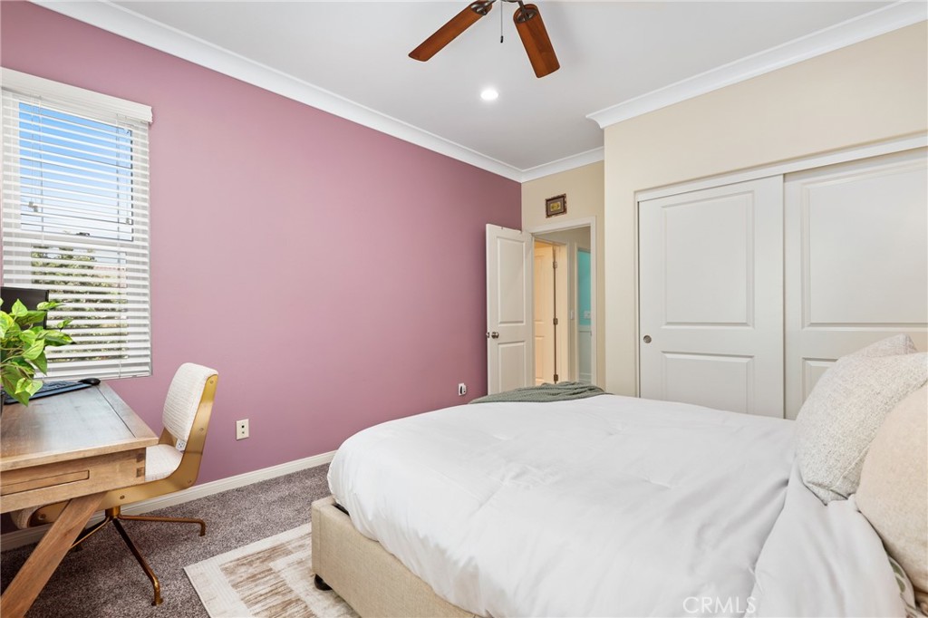 24 Lacebark, Unit 48 Irvine, CA 92618 - Photo 25 of 42 a bedroom with a bed a desk and chair