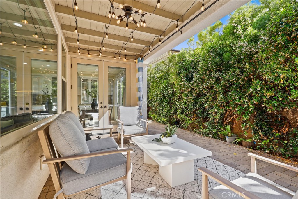 24 Lacebark, Unit 48 Irvine, CA 92618 - Photo 34 of 42 a view of a patio with couches table and chairs and potted plants