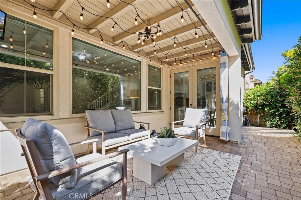 24 Lacebark, Unit 48 Irvine, CA 92618 - Photo 35 of 42 a outdoor space with patio the couches and a dining table with the view of the balcony