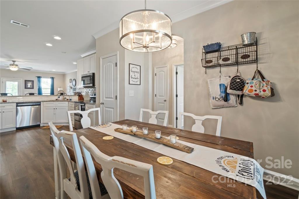 3269 Evondale Road Crouse, NC 28033 - Photo 11 of 36 a kitchen with kitchen island stainless steel appliances a stove a sink and a refrigerator