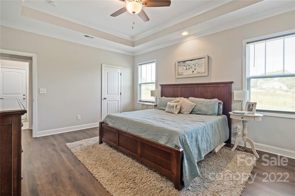 3269 Evondale Road Crouse, NC 28033 - Photo 16 of 36 a bedroom with a large bed and a chandelier