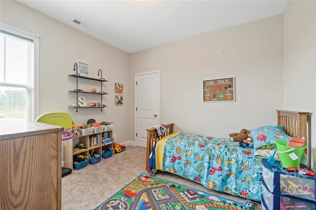 3269 Evondale Road Crouse, NC 28033 - Photo 27 of 36 a kids bedroom with a bed and a window