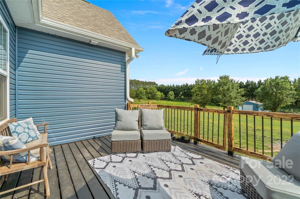 3269 Evondale Road Crouse, NC 28033 - Photo 30 of 36 a view of a patio with a table chairs and a potted plant