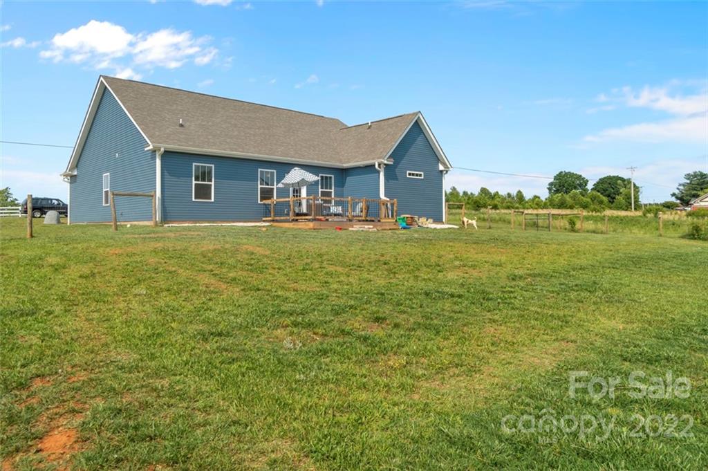 3269 Evondale Road Crouse, NC 28033 - Photo 33 of 36 a front view of a house with a garden and yard
