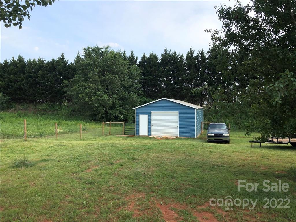 3269 Evondale Road Crouse, NC 28033 - Photo 36 of 36 a car parked in front of a house with a yard