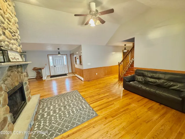 a bathroom with a sink a toilet and shower curtain