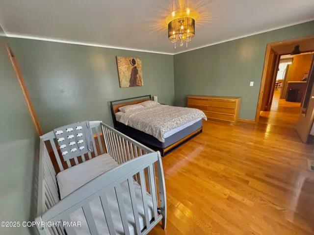 a spacious bedroom with a bed and a couch