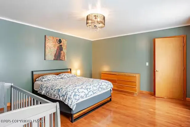 a bathroom with a sink a toilet a mirror a vanity and shower