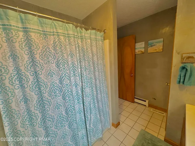 a bedroom with two beds and painted walls