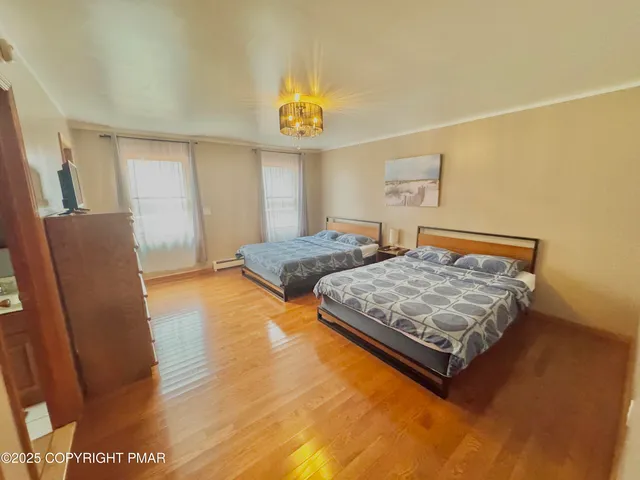 a bedroom with a bed and a mirror