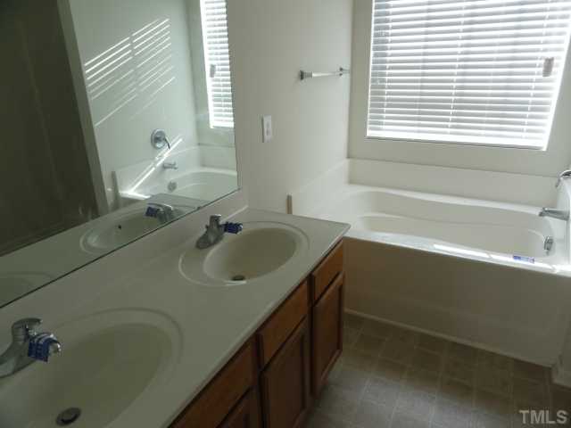 3441 Ferdilah Lane Raleigh, NC 27610 - Photo 7 of 12 a bathroom with a sink and a bathtub