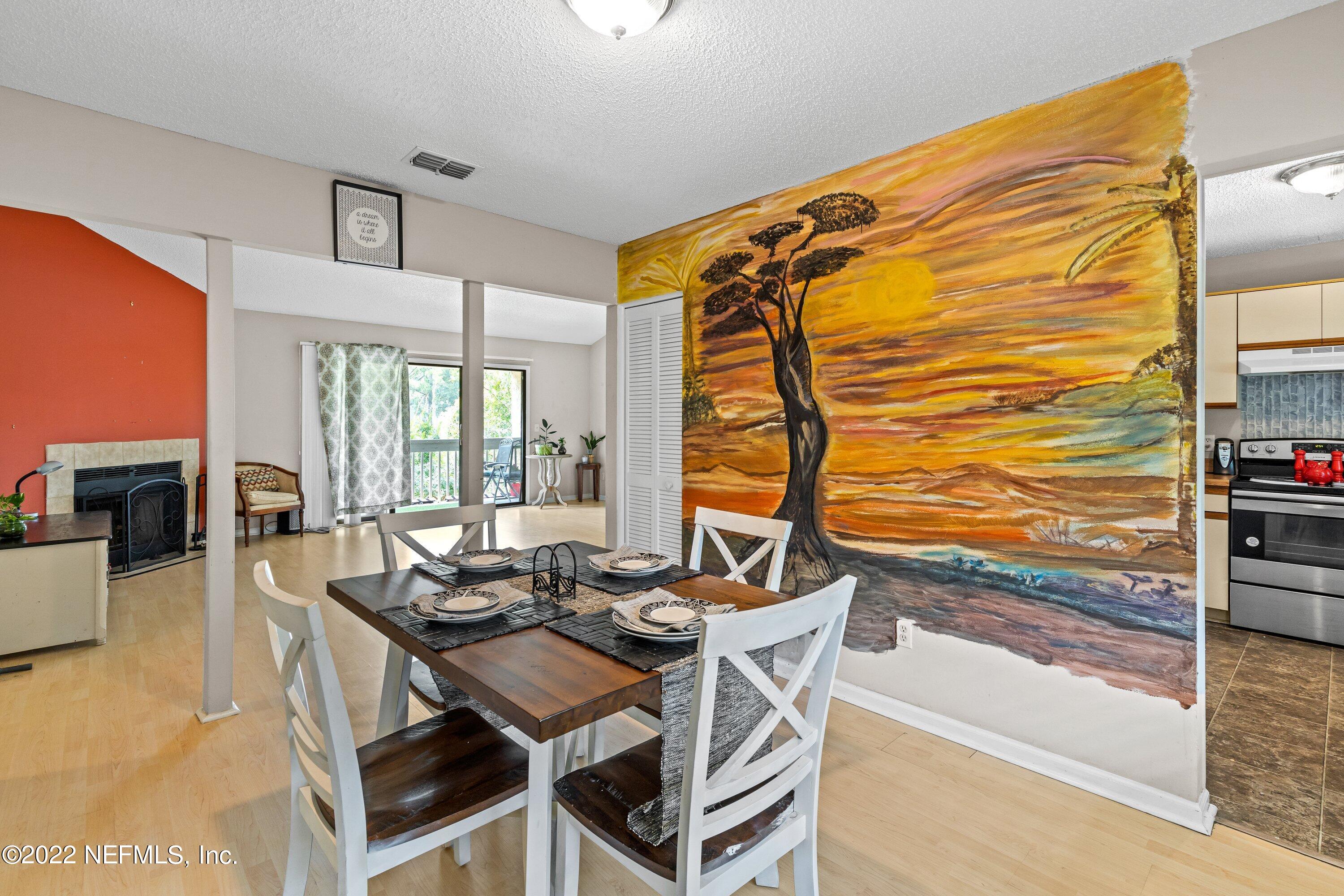 3801 Crown Point Road, Unit 2214 Jacksonville, FL 32257 - Photo 11 of 27 a dining room with furniture and wooden floor