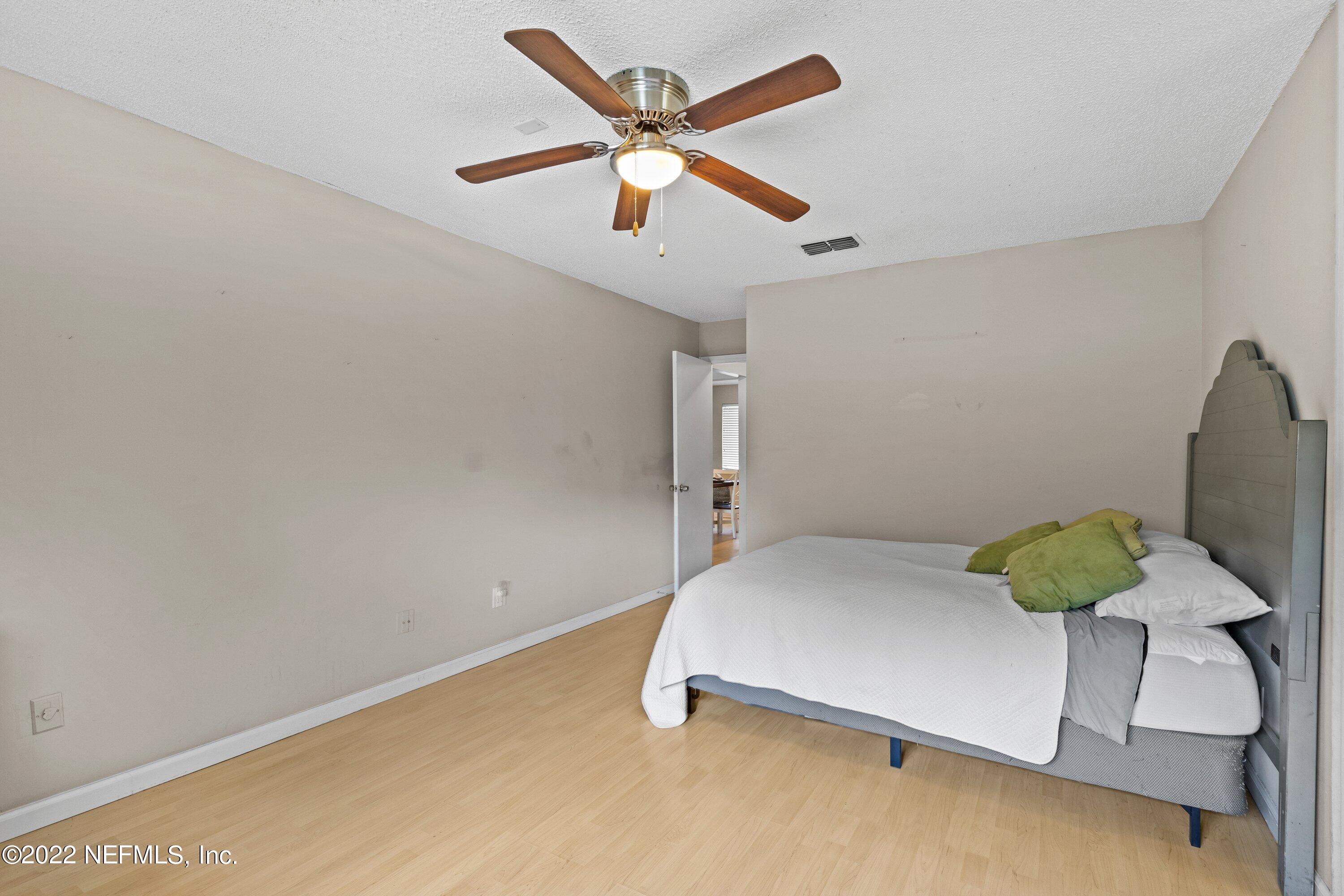 3801 Crown Point Road, Unit 2214 Jacksonville, FL 32257 - Photo 14 of 27 a bedroom with a bed