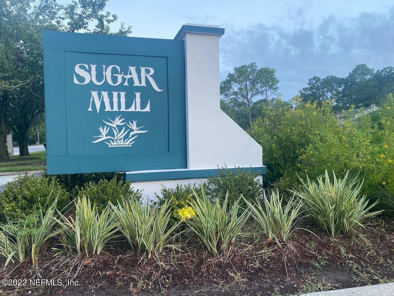 3801 Crown Point Road, Unit 2214 Jacksonville, FL 32257 - Photo 2 of 27 a sign that is on a wooden wall