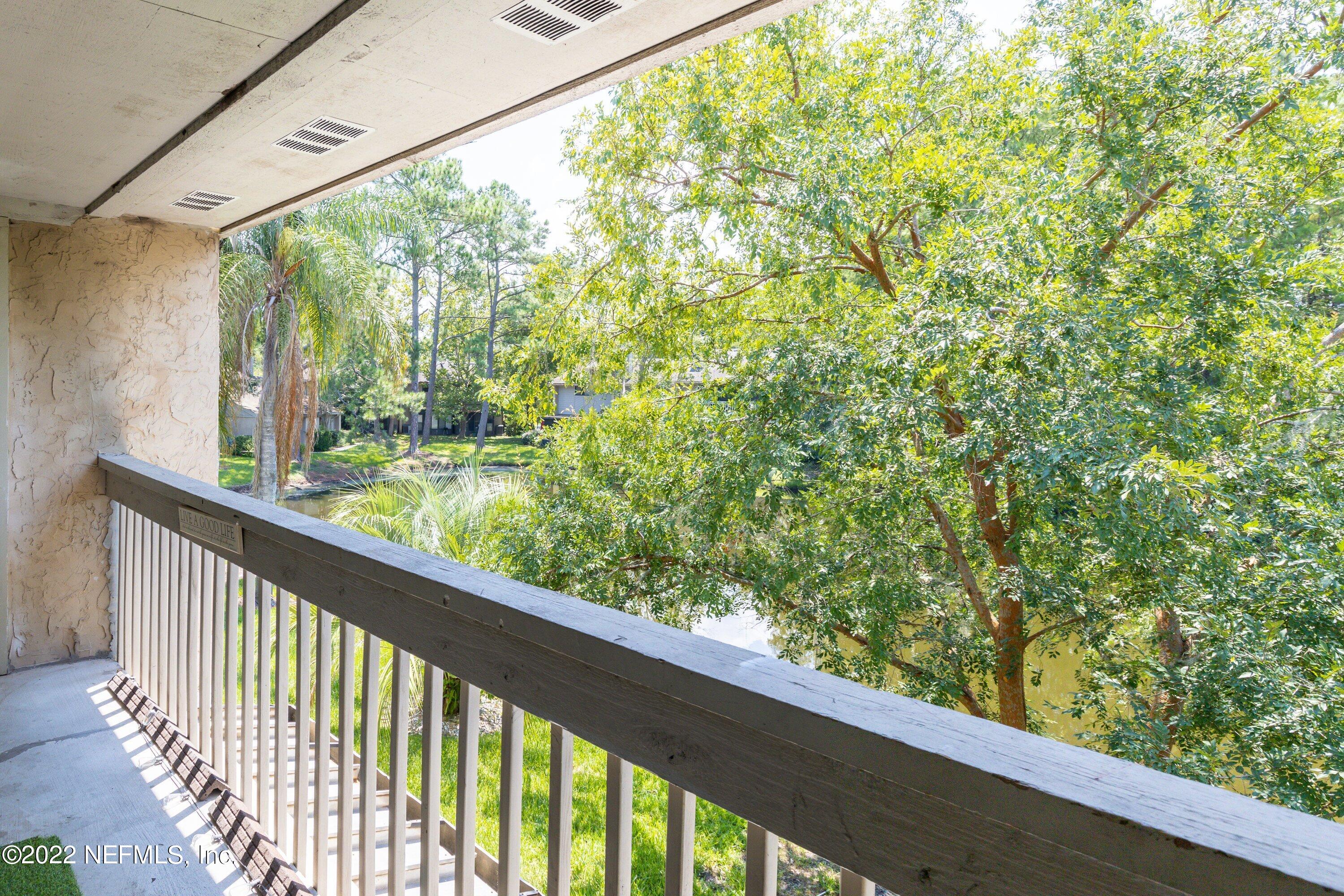 3801 Crown Point Road, Unit 2214 Jacksonville, FL 32257 - Photo 21 of 27 a view of a garden from a balcony