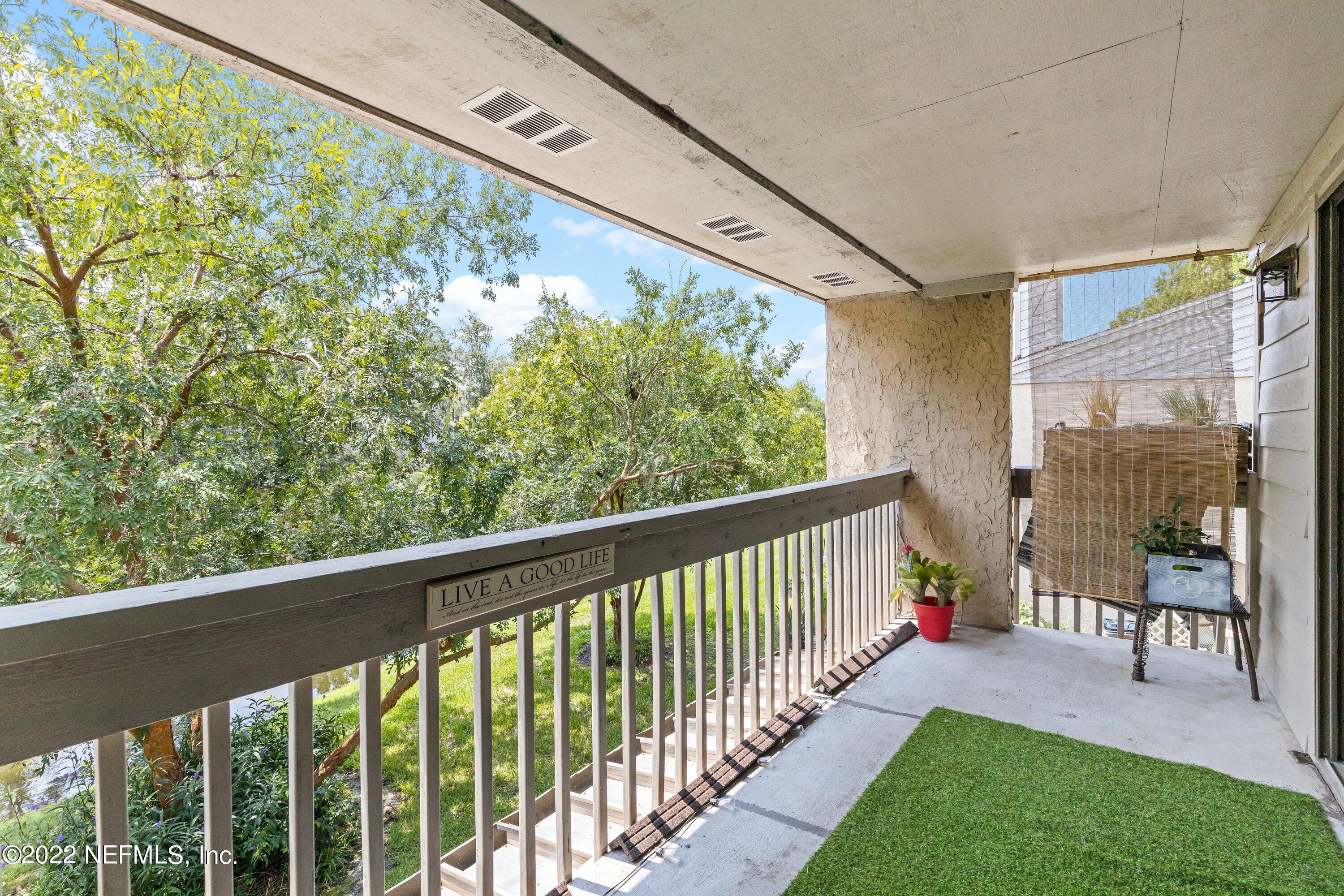 3801 Crown Point Road, Unit 2214 Jacksonville, FL 32257 - Photo 23 of 27 a view of a porch and garden